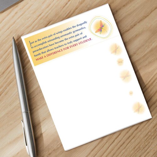paraeducator notepad and silver pen sitting on a desk