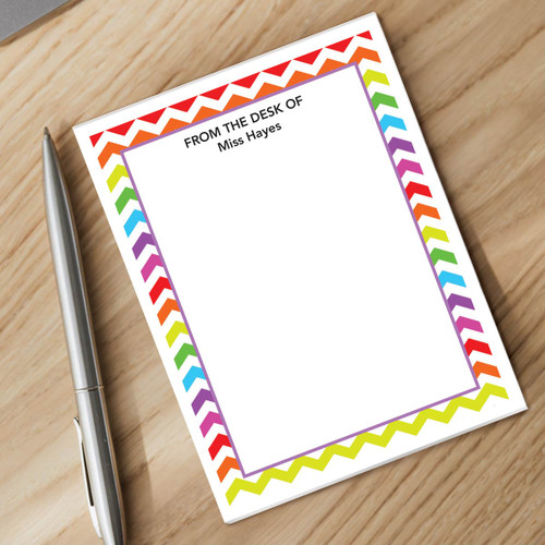 personalized chevron patterned notepad and silver pen sitting on a desk