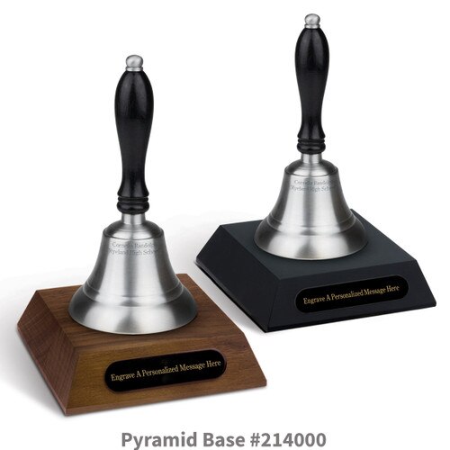 black and a brown walnut pyramid bases with black brass plates and pewter bells