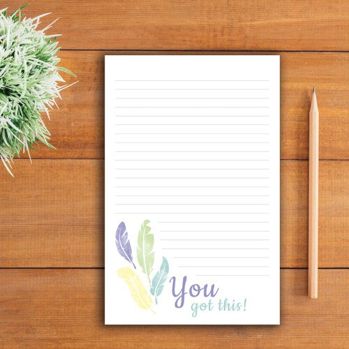 you got this large notepad sitting on a table