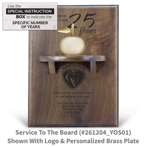 years of service message on a walnut plaque with a shelf, brass apple bell and personalized brass plate