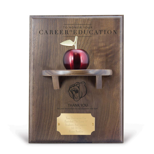 career in education message on a walnut plaque with a shelf, red apple bell and personalized brass plate