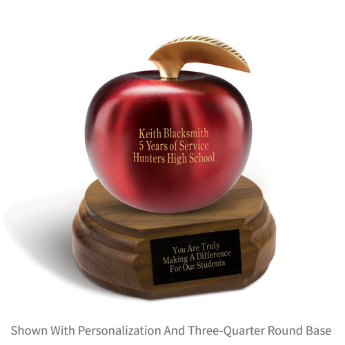 personalized crimson finished brass apple sitting on top a walnut base with black brass plate
