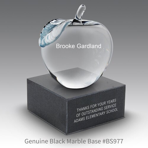personalized crystal apple sitting on top a black marble base with personalizaton
