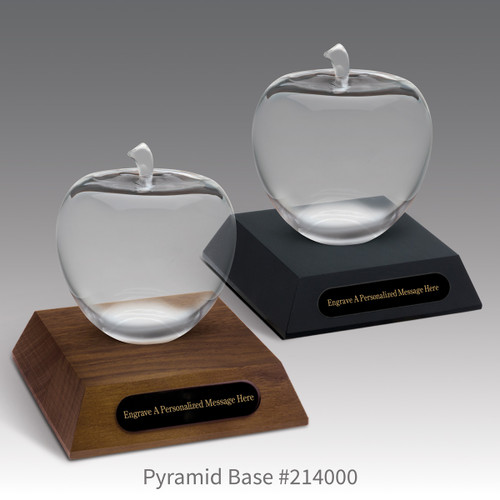 black and a brown walnut pyramid bases with black brass plates and optic crystal apples