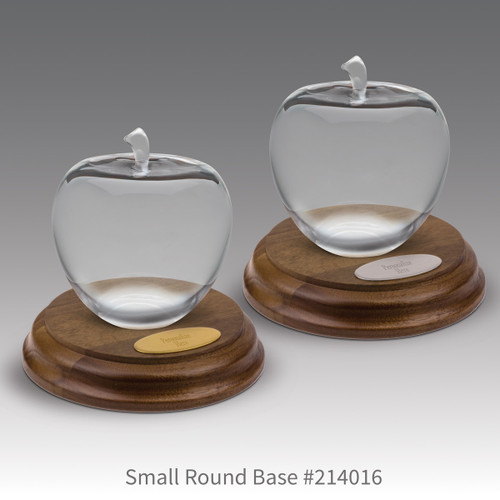 round walnut bases with brass and silver plates and optic crystal apples