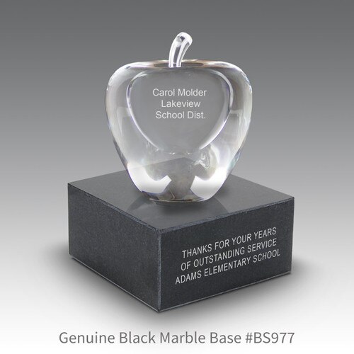 optic crystal apple with personalization sitting on top a black marble base