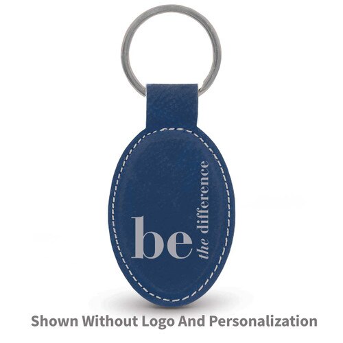 blue oval leather keychain with be the difference message