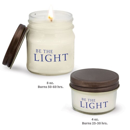 two white candle in glass jar with be the light message