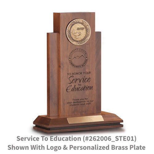 walnut column with brass medallion and service to education message and personalized brass plate