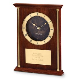 Bulova Achievement Clock featuring brass-tone accent columns and chapter ring with raised Roman numerals.