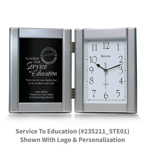 pewter framed clock with service to the education message
