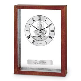 Bulova hardwood framed clock featuring a silver chapter ring with metal geared skeleton movement.