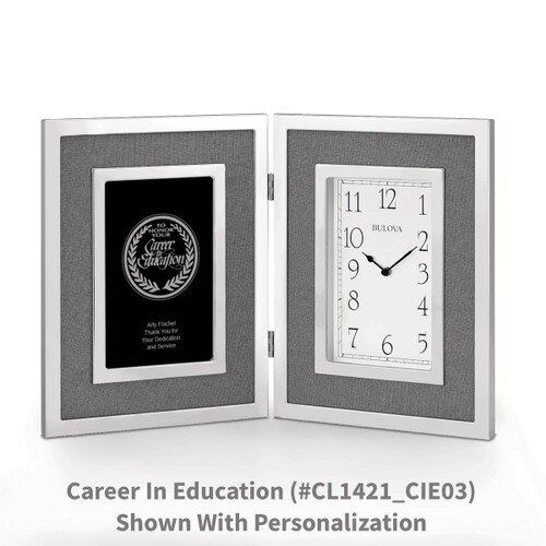 large silver framed clock with career in education message