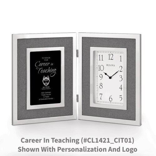 large silver framed clock with career in teaching message