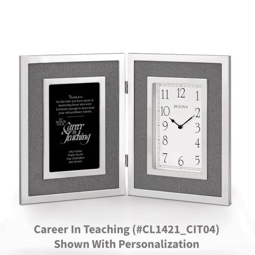 large silver framed clock with career in teaching message