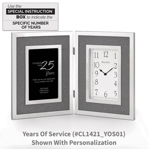 large silver framed clock with years of service message