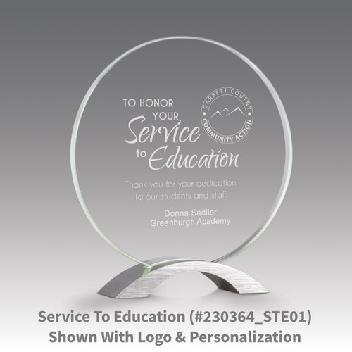 base award with circular jade tinted faceted glass and service to education message