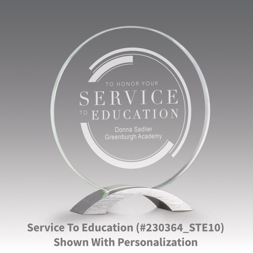 base award with circular jade tinted faceted glass and service to education message