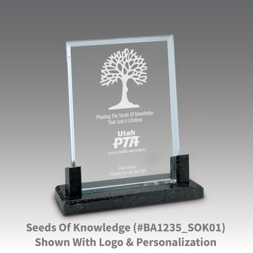 crystal award with marble base featuring seeds of knowledge message