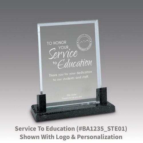 crystal award with marble base featuring service to education message