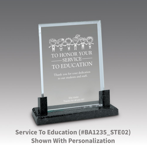 crystal award with marble base featuring service to education message