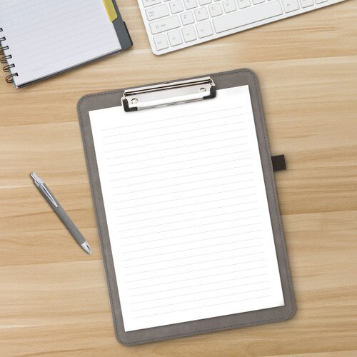 gray clipboard and pen sitting a desk
