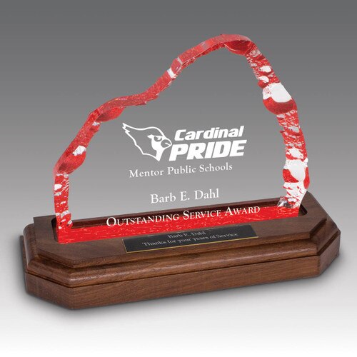 red acrylic iceberg with custom design on a brown routed base with personalized plate
