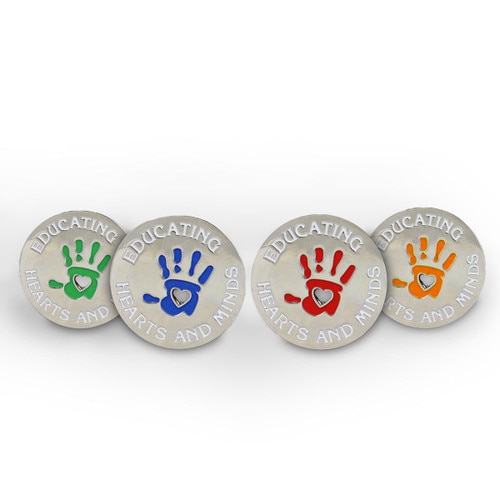 4 colors of the educating hearts and minds lapel pin