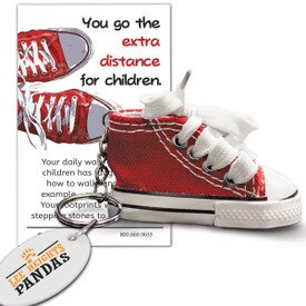 red sneaker key ring with you go the extra distance message card