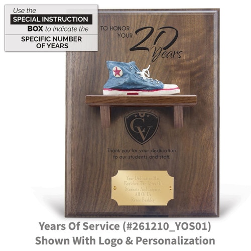 years of service message on a walnut plaque with a shelf, resin blue shoe and personalized brass plate