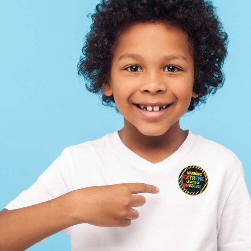 a child wearing a extreme levels of awesome button