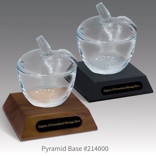 black and a brown walnut pyramid bases with black brass plates and glass apple dishes