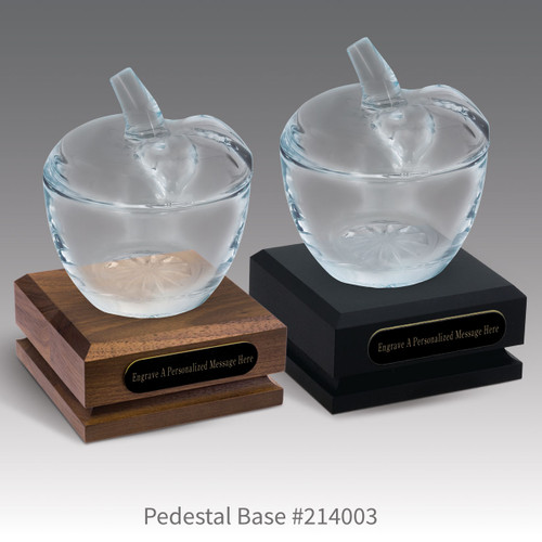 black and a brown walnut pedestal bases with black brass plates and glass apple dishes