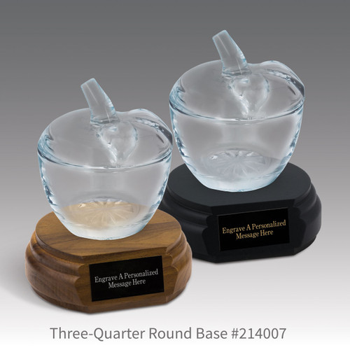 black and a brown walnut three-quarter round bases with black brass plates and glass apple dishes