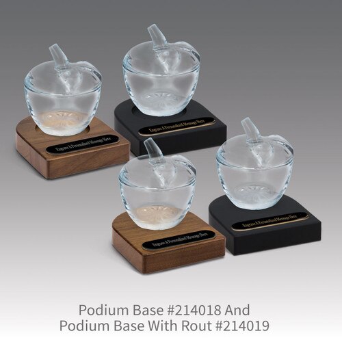 black and brown walnut podium bases with black brass plates and glass apple dishes