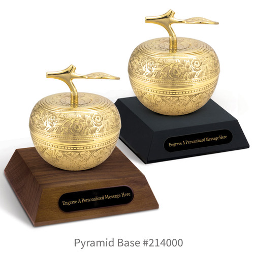 black and a brown walnut pyramid bases with black brass plates and gold embossed apple dishes