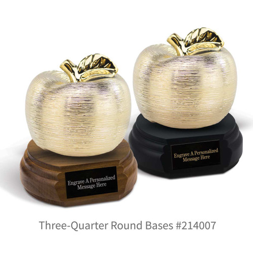 black and a brown walnut three-quarter round bases with black brass plates and gold spun apples