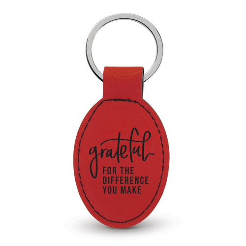 red oval leather keychain with grateful message