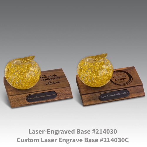 laser engraved walnut bases with black brass plates and handblown 23k gold apples
