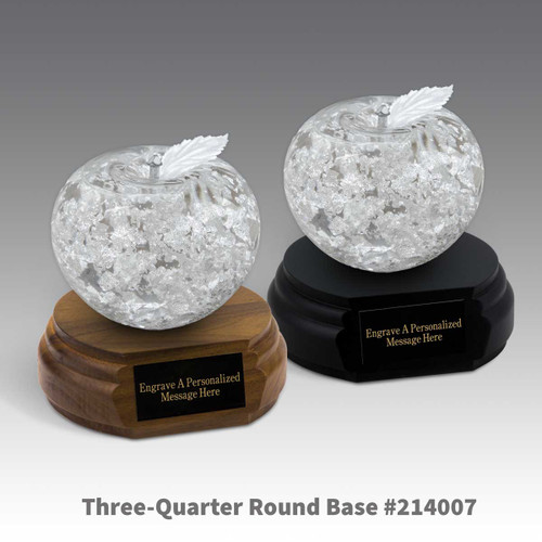 black and a brown walnut three-quarter round bases with black brass plates and handblown fine silver apples