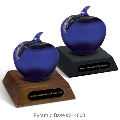 black and a brown walnut pyramid bases with black brass plates and blue handblown glass apples