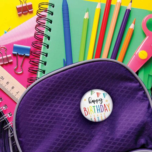 happy birthday button on a backpack