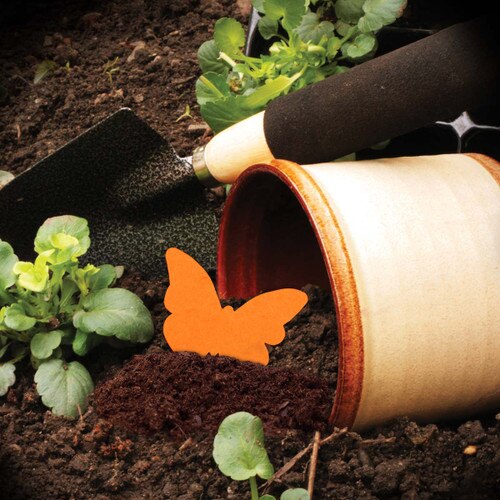flower pot with dirt and shovel