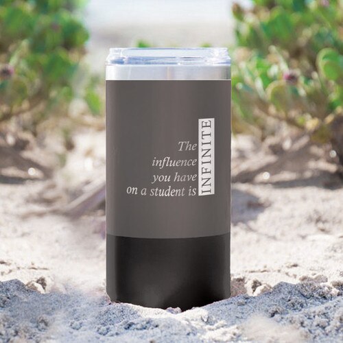 two tone charcoal stainless steel tumbler with infinity message sitting in sand