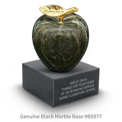 black marble base with green marble apple