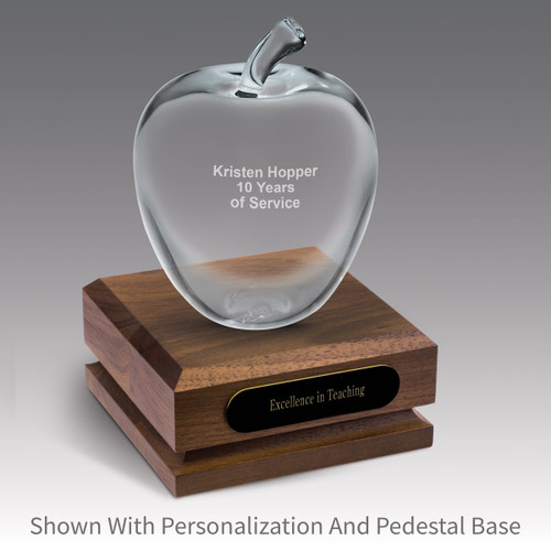 large personalized optic crystal apple sitting on top a walnut base with black brass plate