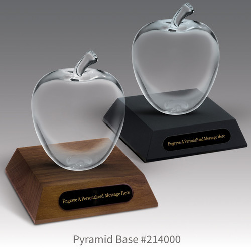 black and a brown walnut pyramid bases with black brass plates and large optic crystal apples