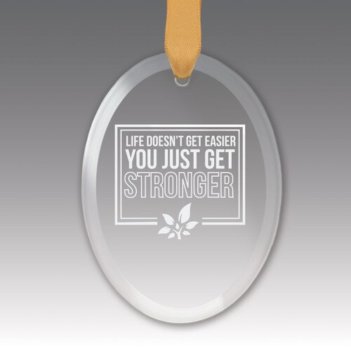 This Premium Crystal Oval Shaped Suncatcher Ornament Features The Inspirational Laser Engraved Message “Life Doesn’t Get Easier You Just Get Stronger”