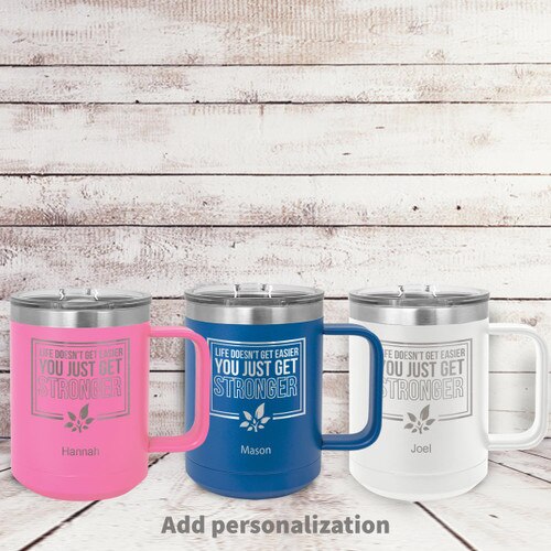 pink, blue and white insulated coffee mugs with Life Doesn't Get Easier message